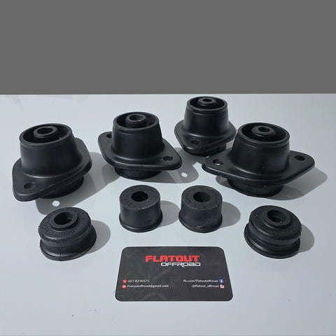 Set of 1998 to 2004 Toyota Hilux body bushing set out on a white and grey background with the flatout offroad logo